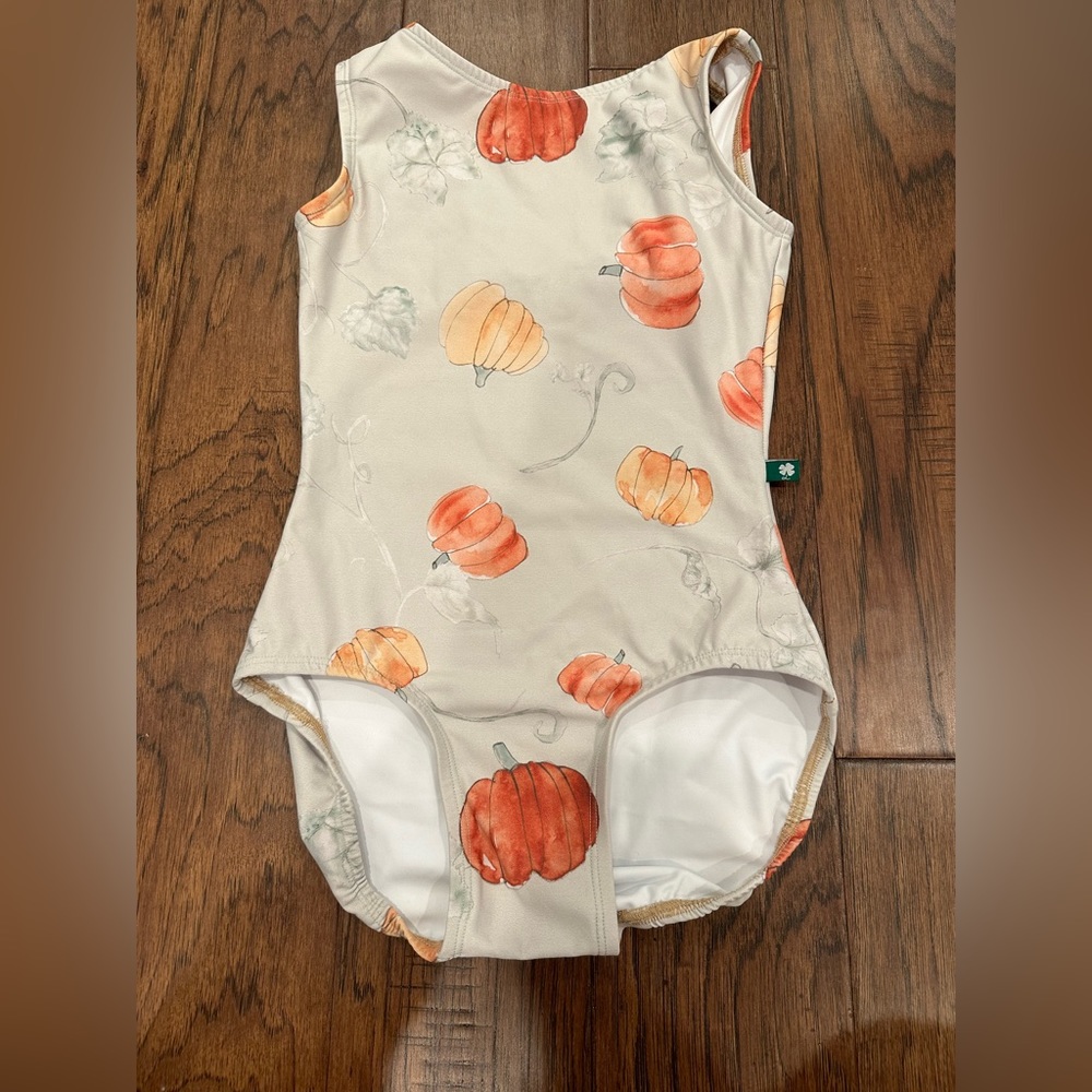 Luckyleo leotard is a tank style with high back scoop in Size Small.
